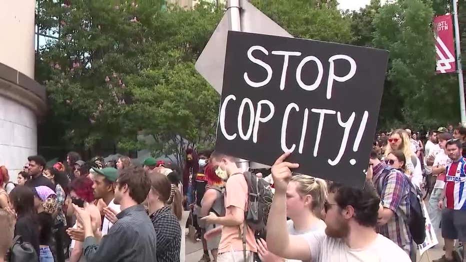 Hundreds of protesters opposing the planned Atlanta Public Safety Training Center march in front of Atlanta City Hall on June 5, 2023.