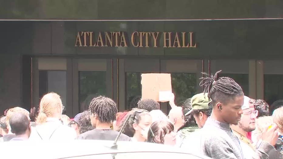 Hundreds of protesters opposing the planned Atlanta Public Safety Training Center march in front of Atlanta City Hall on June 5, 2023.