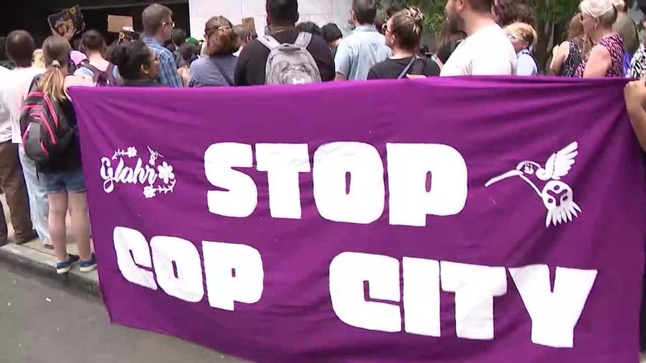 Hundreds of protesters opposing the planned Atlanta Public Safety Training Center march in front of Atlanta City Hall on June 5, 2023.