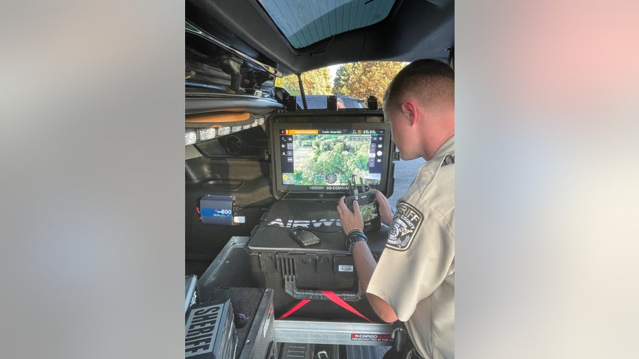 A deputy flies a drone over a section of Henry County searching for stray cattle on June 13, 2023.