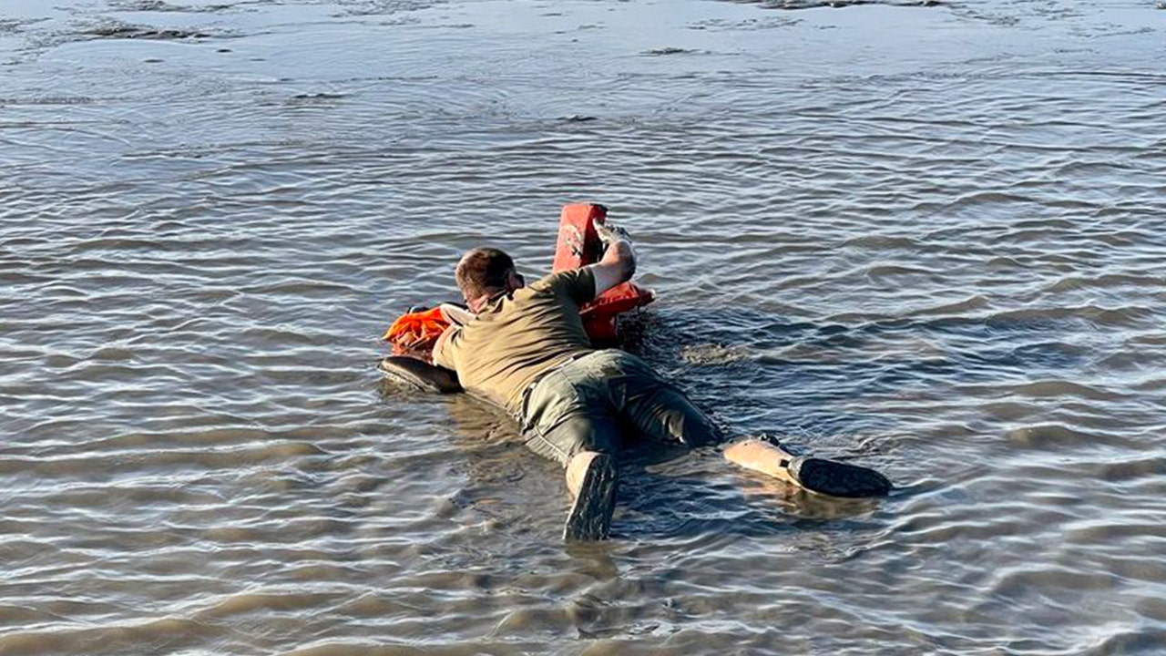 Wildlife officials use rafts made of life jackets to rescue stranded boaters Wildlife officials use rafts made of life jackets to rescue stranded boaters