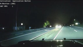 Officer nearly hit head-on by suspect drunk driver while taking DUI suspect to jail