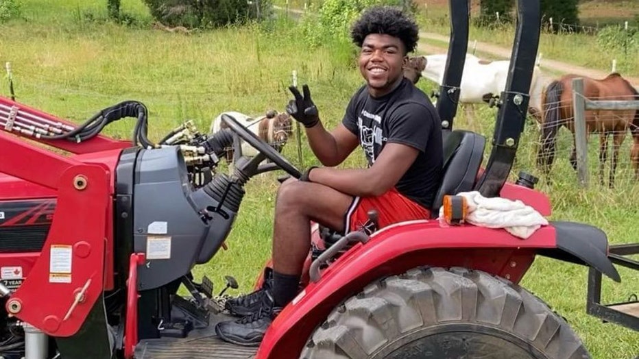Antwon Carter is seen smiling and riding on a tractor in this undated photo.