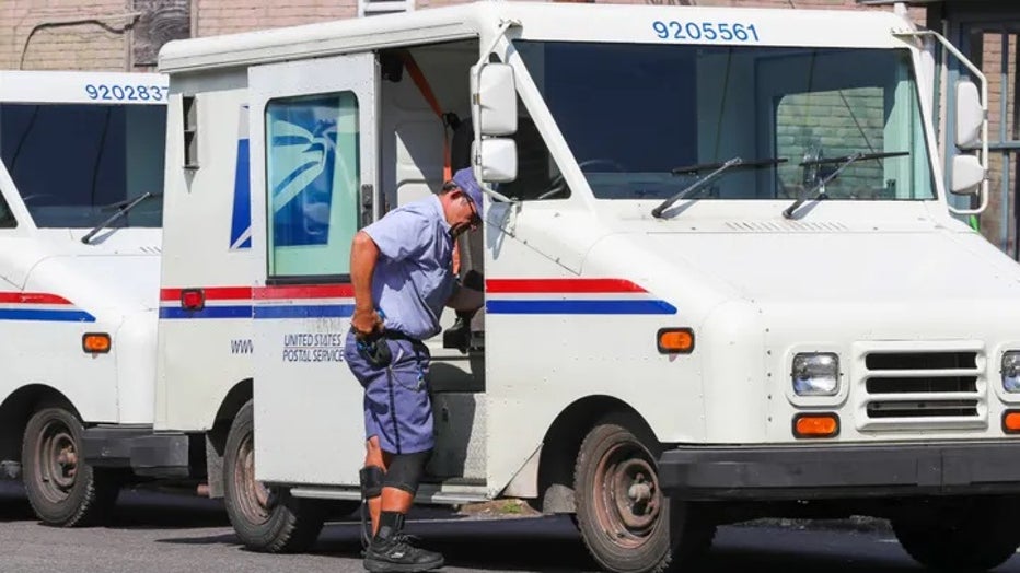 us-postal-service-worker-mail-truck.jpg