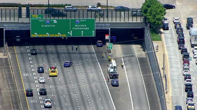 Pedestrian killed trying to cross Downtown Connector, police searching for driver