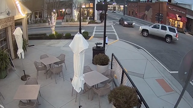 Video: SUV runs red light, gets hit hard by cross traffic