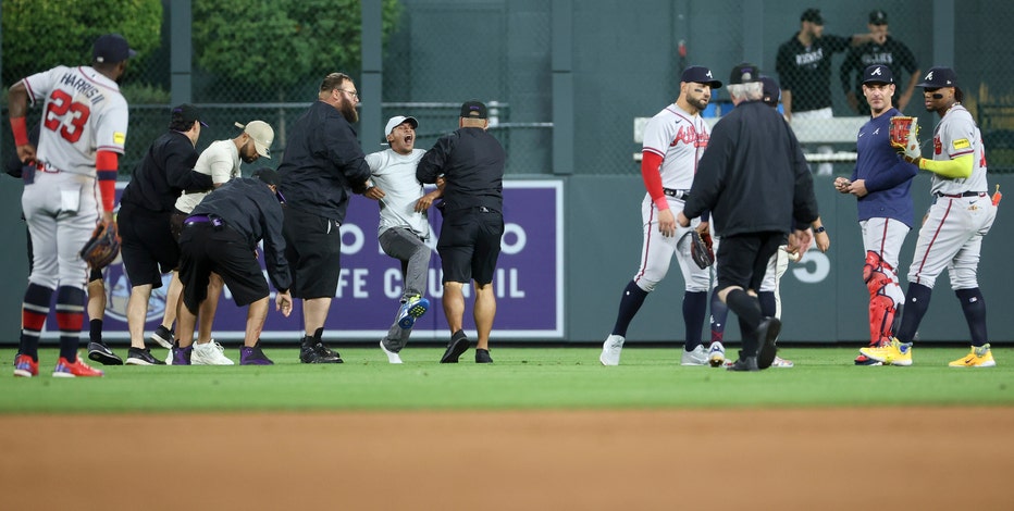 Fans rush field, accost Braves' Ronald Acuna Jr.