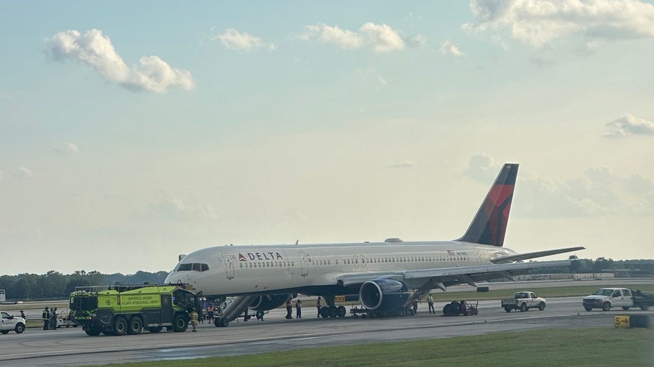A Delta flight was surrounded by emergency crews at Atlanta’s airport on August 2, 2023.