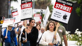 Hollywood writers union leaders end strike as board members approve contract with studios