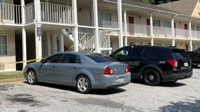Shooting investigation underway at extended-stay motel in Riverdale