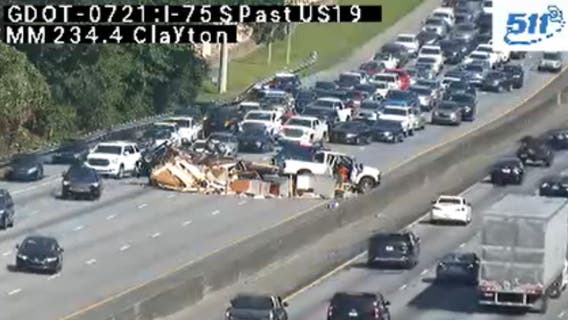 Overturned vehicle blocks traffic on I-75 at Old Dixie Highway