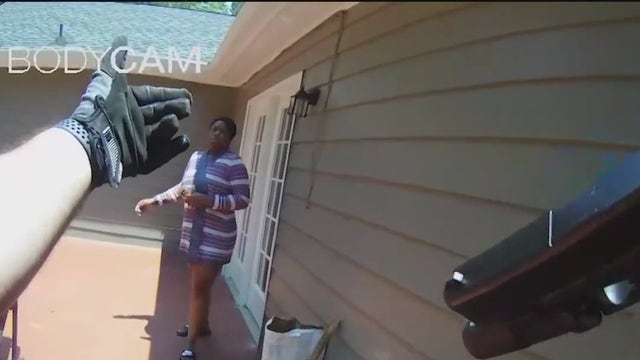 Woman claims police held her to get husband to surrender