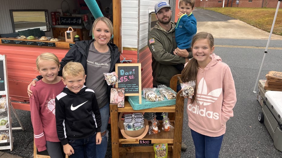 Family poses with cookies