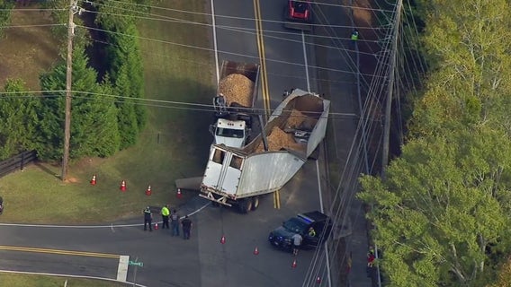 Milton road reopens after crash leaves tractor-trailer cracked in the middle