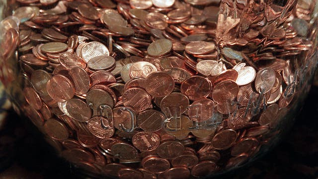 Colorado business pays $23.5K settlement with 6,500 pounds in coins: reports