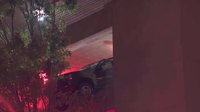 Hanging vehicle safely retrieved from Marietta hospital parking deck