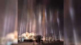 Light pillars illuminate night sky over Canada