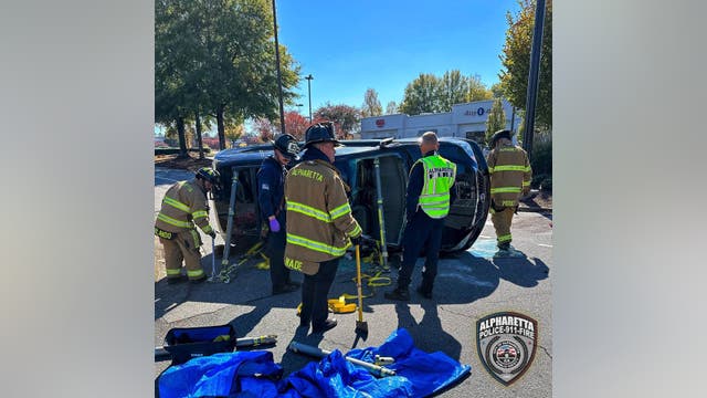 Car tips over at Alpharetta shopping center