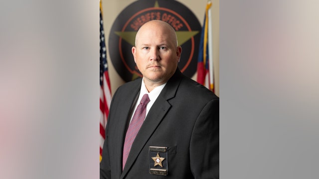 Georgia sheriff's candidate fired after hidden camera catches him sneaking into rival's locked office