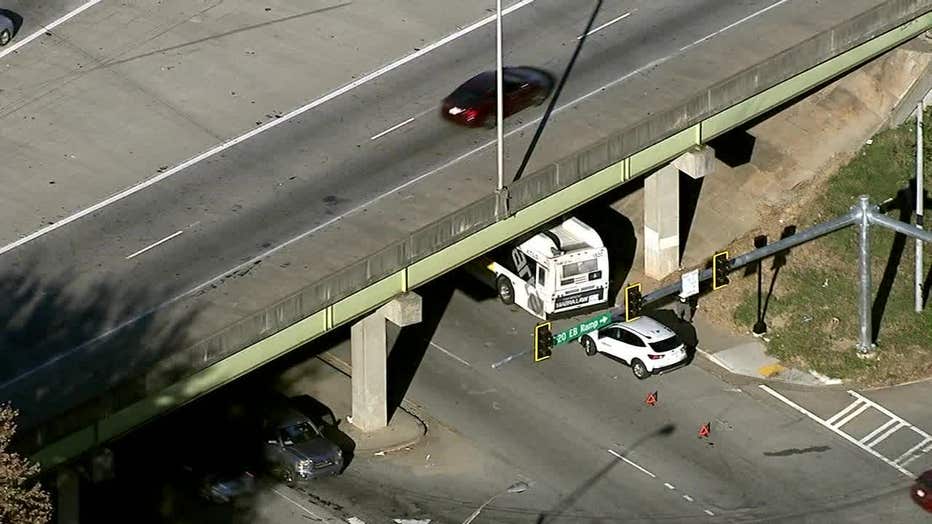 A MARTA bus can be seen under the I-20 overpass at Windsor Street SW in Atlanta after MARTA officials say a car cut it off and collided with it on Nov. 3, 2023.