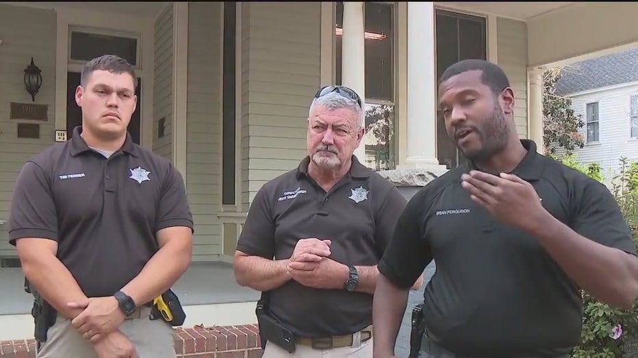 Woodward Academy Security officers Tim Fenner and Brian Ferguson flank Director Jeff Yarborough as they describe saving the lives of three people from a nearby apartment fire, including a 94-year-old woman, on Nov. 14, 2023.