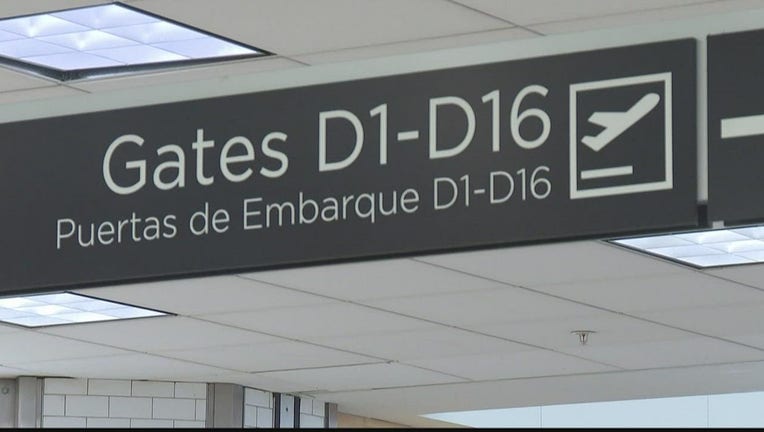 A sign showing the gate numbers along Concourse D at Hartsfield-Jackson Atlanta International Airport.