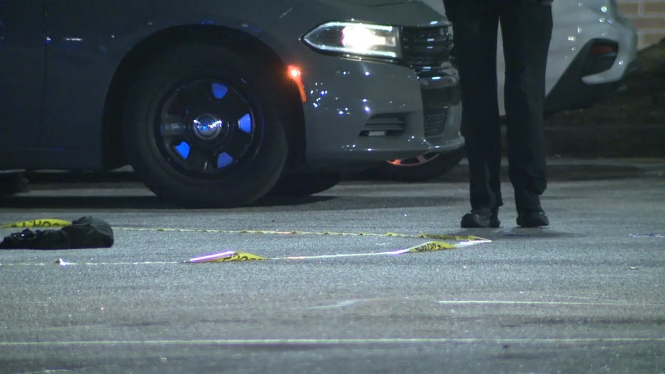 Police tape surround the scene of a shooting in the parking lot of a Walmart in South Fulton on Dec. 22, 2023.