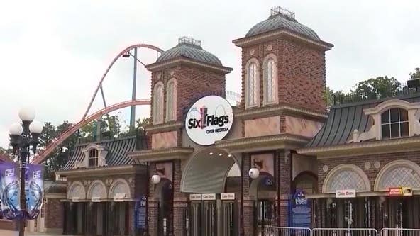 Woman arrested after Six Flags employee fell out of van in October 2023