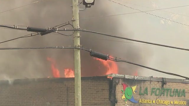 1 person injured in large warehouse fire in Forest Park, officials say