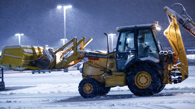 Nor'easter slams Northeast with a foot of snow, flash freeze could lead to dangerous travel in New England