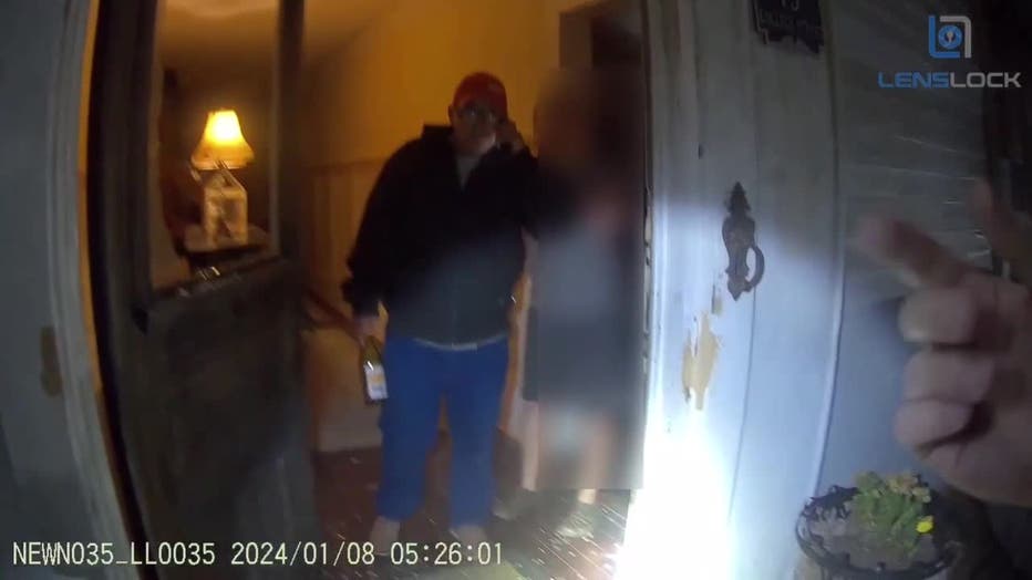 Anthony Mark Chase, seen in body camera video exiting a historic Newnan home, is charged with breaking in with bottle of wine during the early morning hours of Jan. 8, 2024.