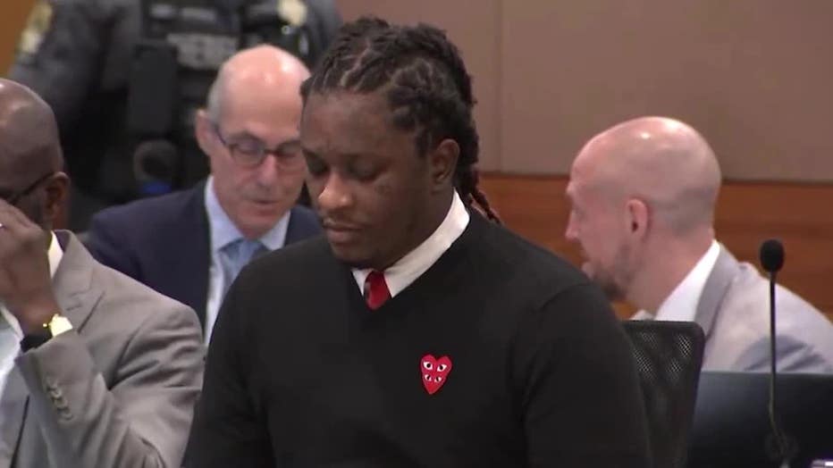 Young Thug, whose legal name is Jeffery Williams, sits in a Fulton County courtroom during the YSL RICO trial wearing a Comme Des Garcons Play sweater on Jan. 11, 2024.