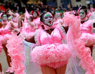 Revelers in a fanciful Barbie costumes participate in the carnival