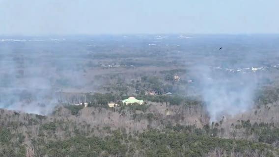 Fire crews respond to fire in wooded area near US 78 in Stone Mountain