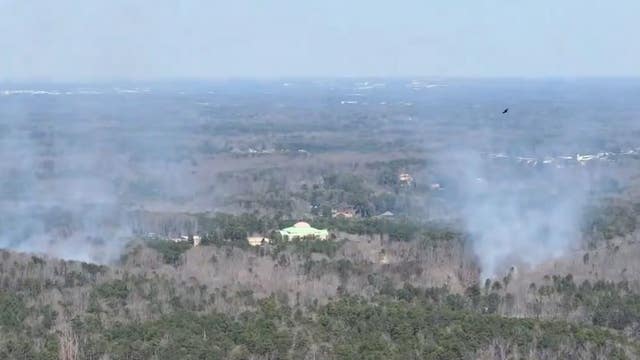 Fire crews respond to fire in wooded area near US 78 in Stone Mountain