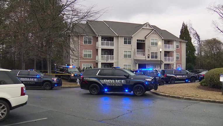 DeKalb County police surround an apartment building located in the 100 block of Camellia on Feb. 28, 2024.