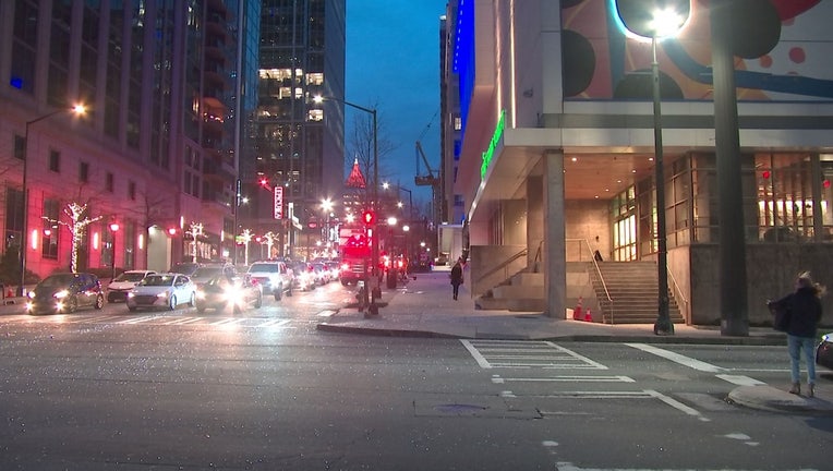 The glitter of glass could be seen along 14th Street after a broken window in Midtown Atlanta on Feb. 28, 2024.