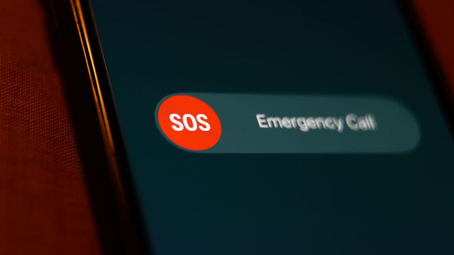FILE - SOS Emergency Call sign displayed on a phone screen. (Photo by Jakub Porzycki/NurPhoto via Getty Images)
