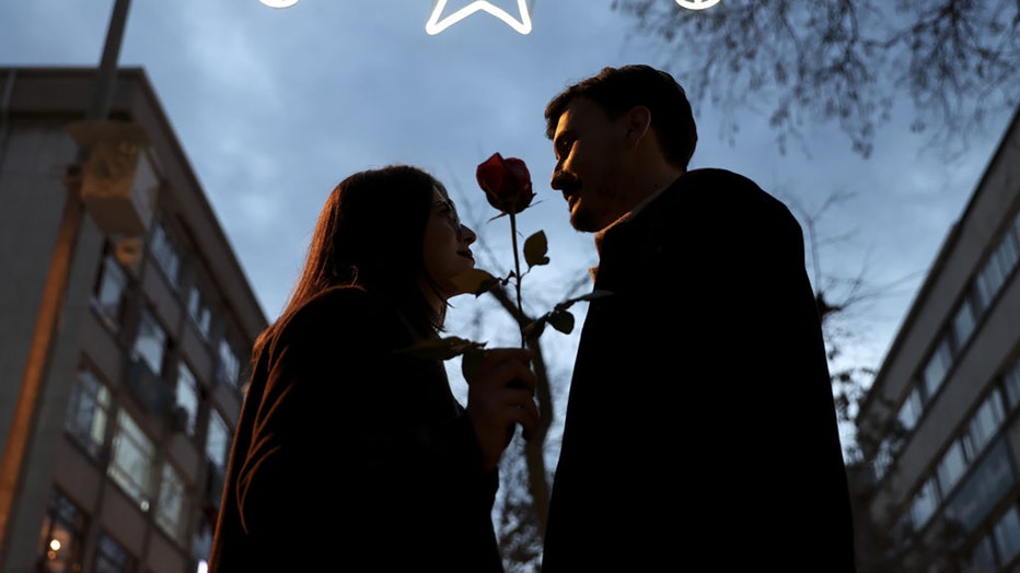 FILE - A couple pose for a photo ahead of Valentines Day on Feb. 11, 2024. (Photo by Dilara Irem Sancar/Anadolu via Getty Images)
