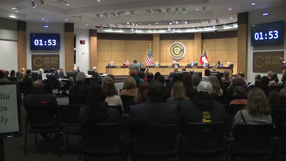 Parents and guardians pack a Cobb County School Board meeting following the shooting at McEachern High School to address safety concerns on Feb. 29, 2024.