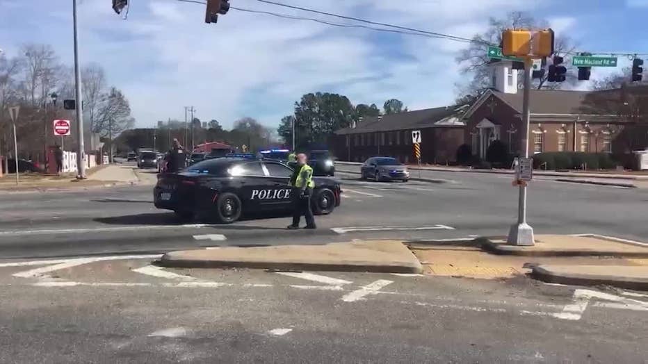 Law enforcement officials flood the area surrounding McEachern High School in Cobb County after a fight among non-students in the parking lot of the campus escalates into gunfire on Feb. 2, 2024.