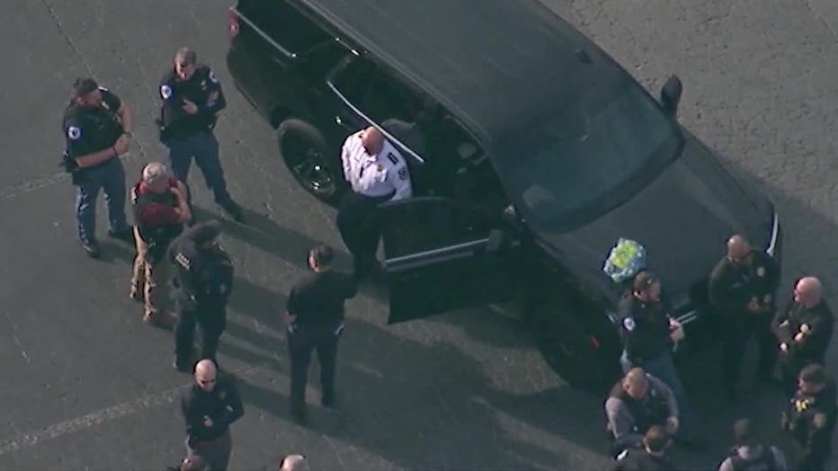 Law enforcement officials flood the area surrounding McEachern High School in Cobb County after a fight among non-students in the parking lot of the campus escalates into gunfire on Feb. 2, 2024.