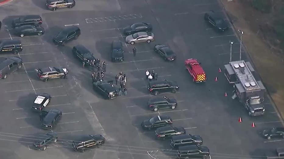 Law enforcement officials flood the area surrounding McEachern High School in Cobb County after a fight among non-students in the parking lot of the campus escalates into gunfire on Feb. 2, 2024.