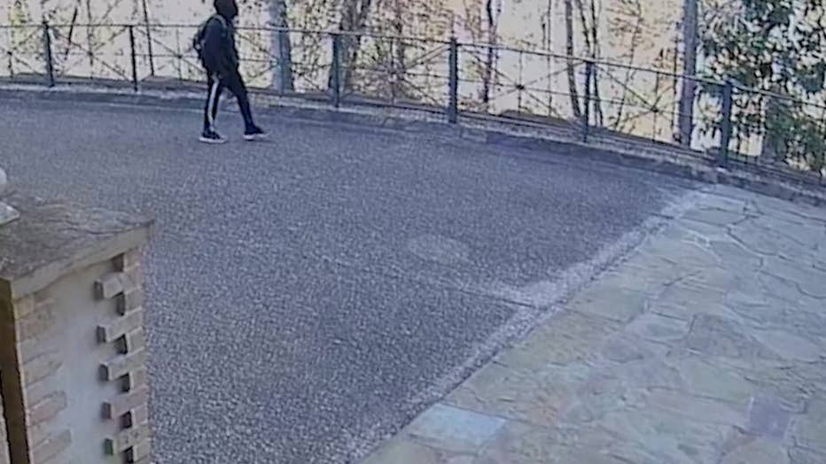 Atlanta police released this image showing a man walking around a Buckhead estate and was later accused of burglarizing it on Jan. 30, 2024.