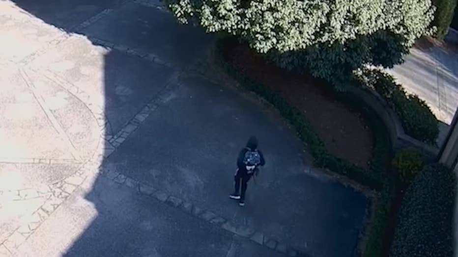 Atlanta police released this image showing a man walking around a Buckhead estate and was later accused of burglarizing it on Jan. 30, 2024.