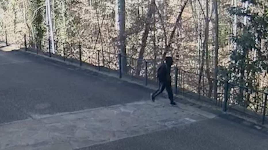 Atlanta police released this image showing a man walking around a Buckhead estate and was later accused of burglarizing it on Jan. 30, 2024.