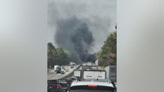 Officer pulls driver from burning tractor-trail on I-85 near Braselton