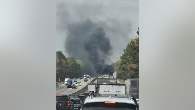 Officer pulls driver from burning tractor-trail on I-85 near Braselton