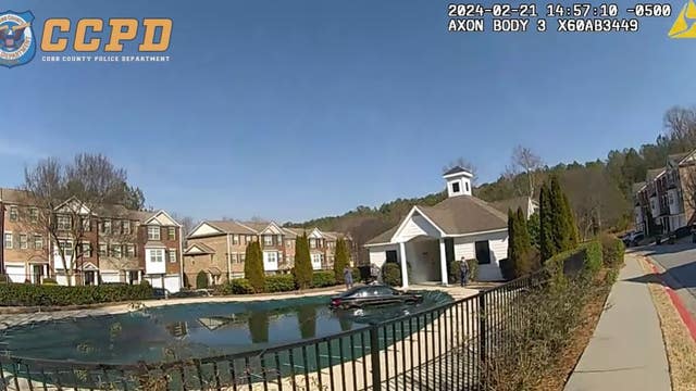 Woman rescued from car after it ends up in pool in Kennesaw