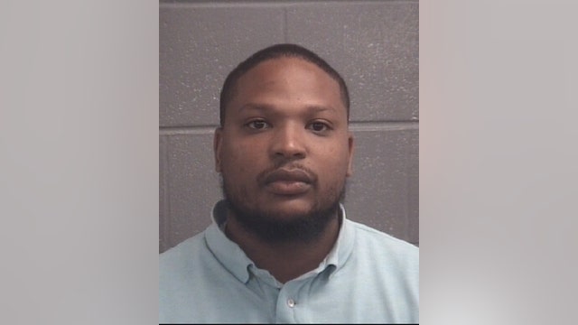 Former Griffin officer accused of improperly investigating brother in murder case turns self in